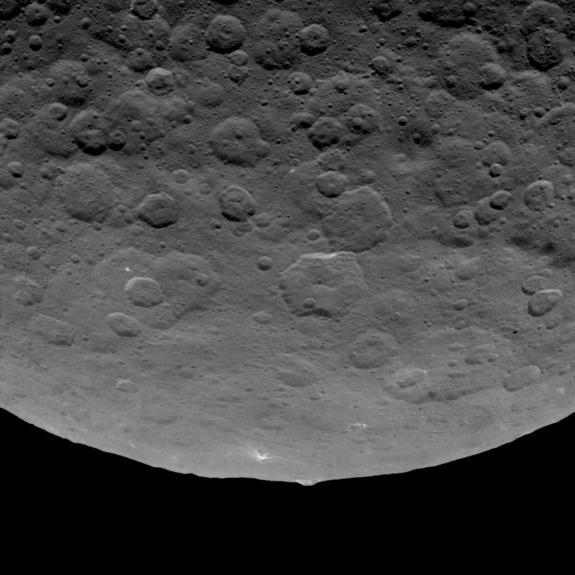 NASA's Dawn spacecraft photographed an intriguing mountain on dwarf planet Ceres protruding from a relatively smooth area. This structure rises an estimated 3 miles (5 kilometers) above the surface. Image taken on June 14, 2015.