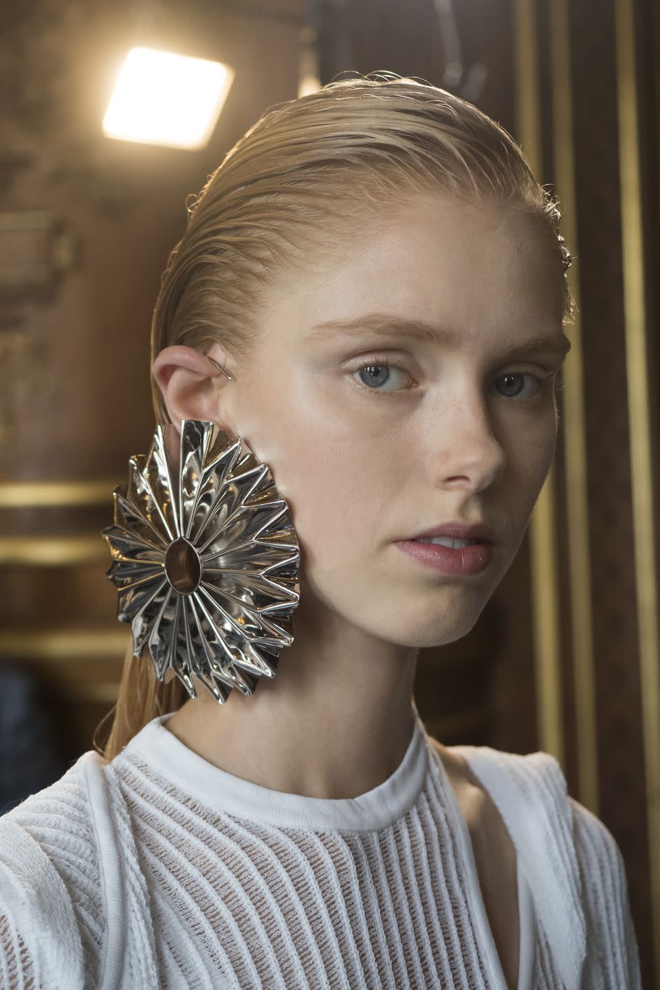 <p>The only way to show off an earring this extra is to slick your hair back with pounds of gel, as seen backstage at Balmain.</p>