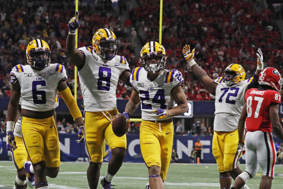 LSU cornerback Derek Stingley Jr. (24) celebrates with teammates his interception against Georgia during the second half of the Southeastern Conference championship NCAA college football game, Saturday, Dec. 7, 2019, in Atlanta. (AP Photo/John Bazemore)