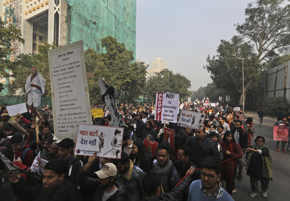Students shout slogans against government during a protest against new citizenship law in New Delhi, India, Tuesday, Dec. 24, 2019. Hundreds of students marched Tuesday through the streets of New Delhi to Jantar Mantar, an area designated for protests near Parliament, against the new citizenship law, that allows Hindus, Christians and other religious minorities who are in India illegally to become citizens if they can show they were persecuted because of their religion in Muslim-majority Bangladesh, Pakistan and Afghanistan. It does not apply to Muslims. (AP Photo/Manish Swarup)