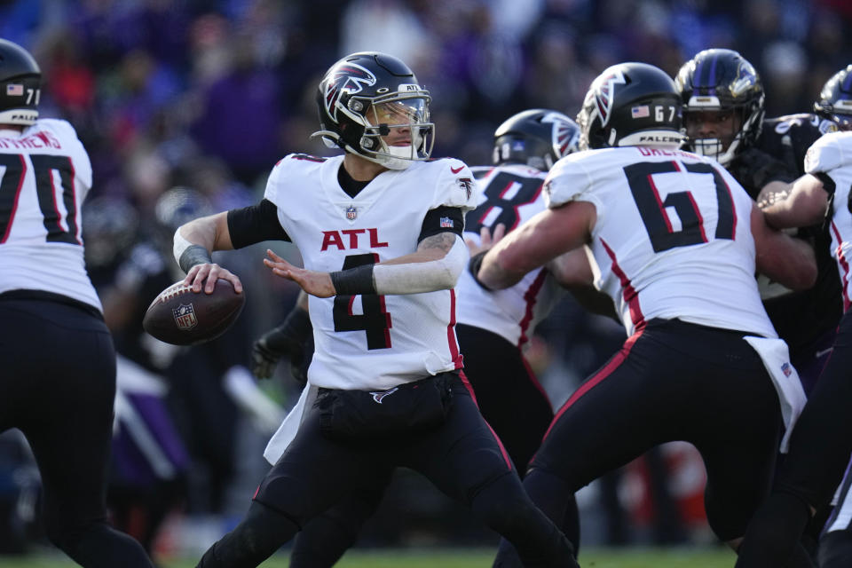 Atlanta Falcons quarterback Desmond Ridder (4) drops back to pass during the first half of an NFL football game against the Baltimore Ravens, Saturday, Dec. 24, 2022, in Baltimore. (AP Photo/Julio Cortez)