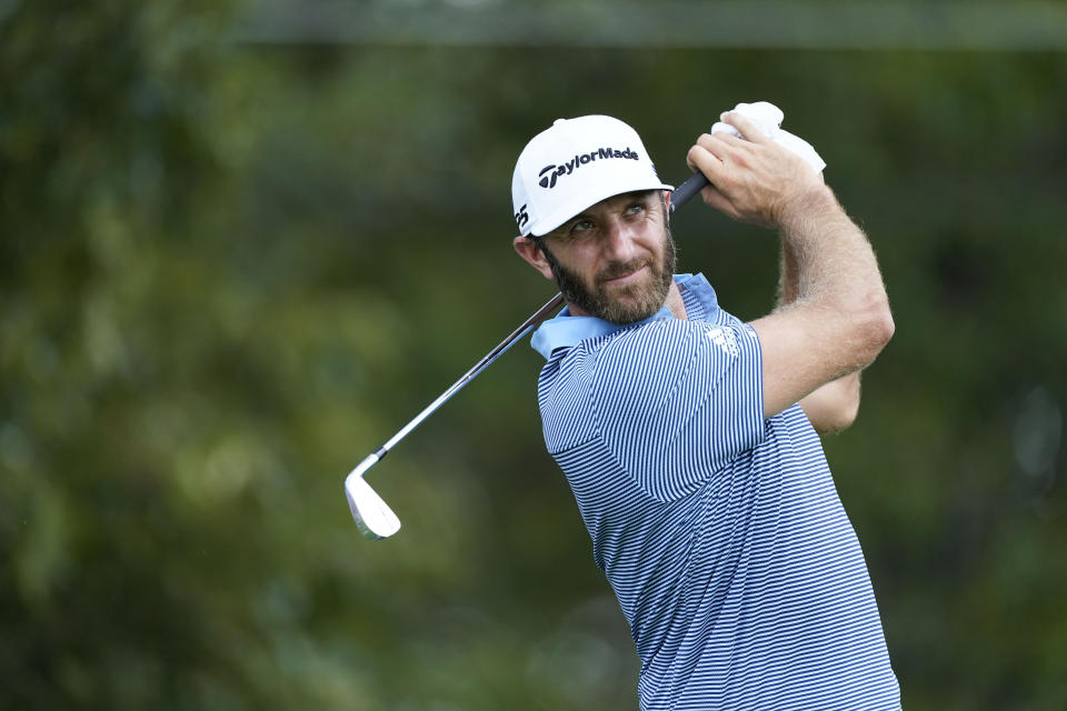 Dustin Johnson hits on the third tee during the first round of the Tour Championship golf tournament at East Lake Golf Club in Atlanta, Friday, Sept. 4, 2020. (AP Photo/John Bazemore)
