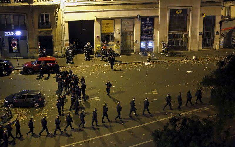 FILE PHOTO: French police with protective shields walk in line near the Bataclan concert hall following fatal shootings in Paris