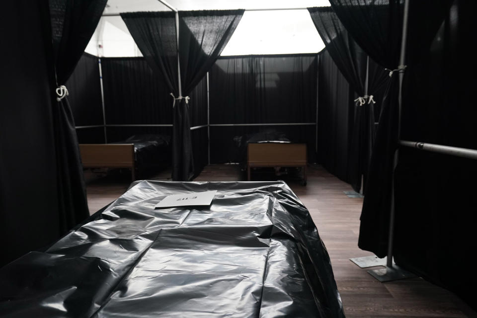 Image: Rows of beds separated by black fabric are set up as a temporary field hospital for COVID-19 patients is under construction at the USTA Billie Jean King national tennis center in the Borough of Queens (Bryan R. Smith / AFP - Getty Images)