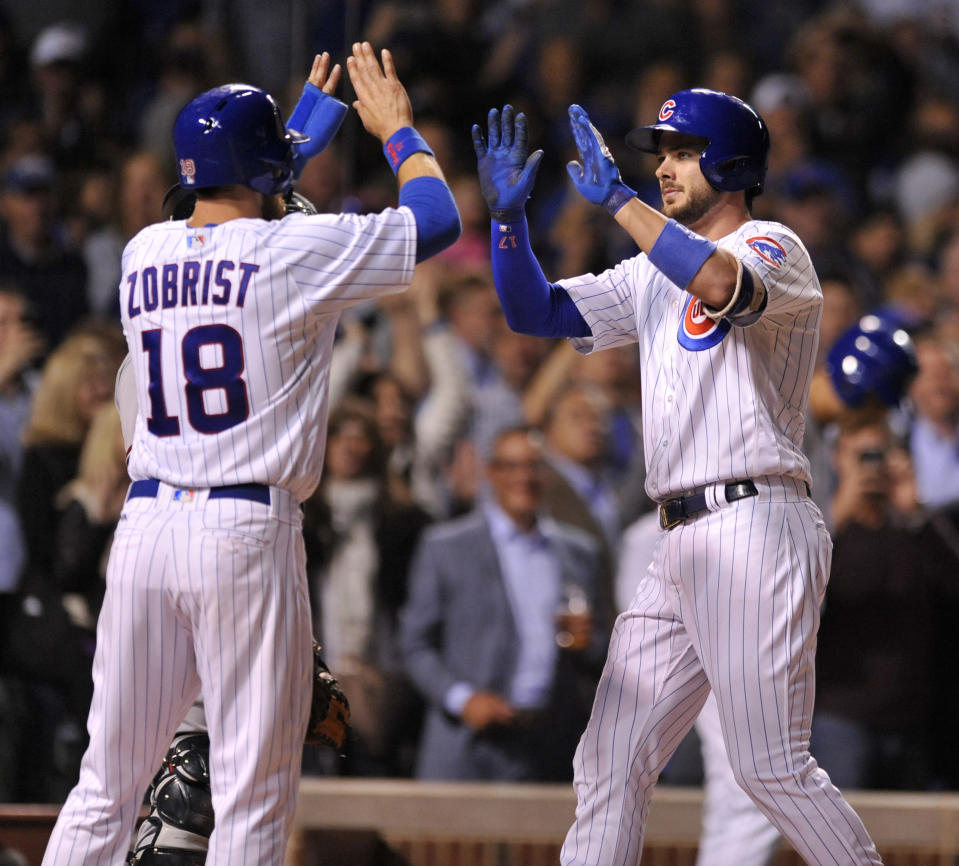Chicago Cubs’ Kris Bryant (right) celebrates with teammate Ben Zobrist (left) at home plate. (AP)
