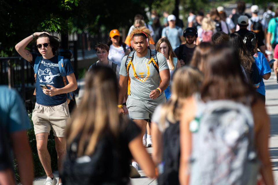 Students walk past Fred Brown Hall during the first day of the fall semester on the University of Tennessee's campus in Knoxville on Aug. 23.