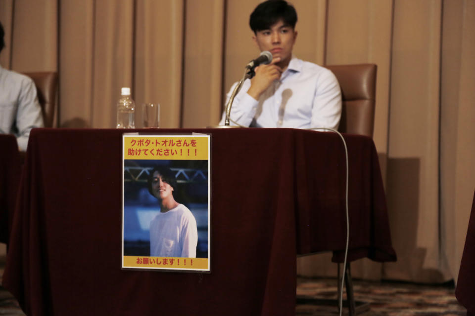 Images of Toru Kubota, a Japanese journalist detained in Myanmar while covering a protest, are displayed at the Japan Press Club in Tokyo, Wednesday, Aug. 3, 2022. Friends of Kubota gathered at the club calling for his immediate release. (AP Photo/Yuri Kageyama)