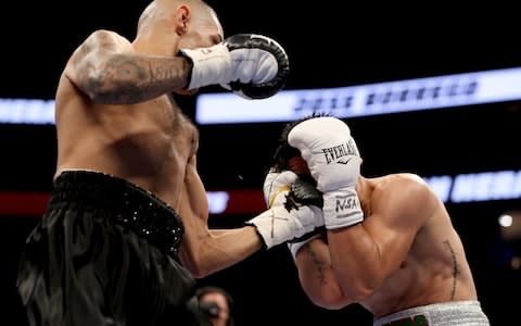 Juan Heraldez works a punch through Jose Borrego's guard  - Credit: Christian Petersen/Getty Images