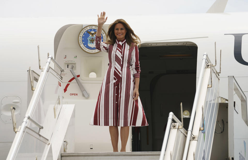 FLOTUS changed into a striped Celine number before landing in Accra, Ghana. (Photo: Carolyn Kaster/AP)