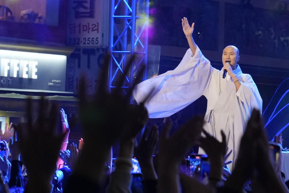 NewJeansNim, a comedian and a DJ, whose real name is Youn Sung Ho, performs at an annual lantern-lighting festival dressed up as a monk, in Seoul, South Korea, on May 12, 2024. (AP Photo/Juwon Park)