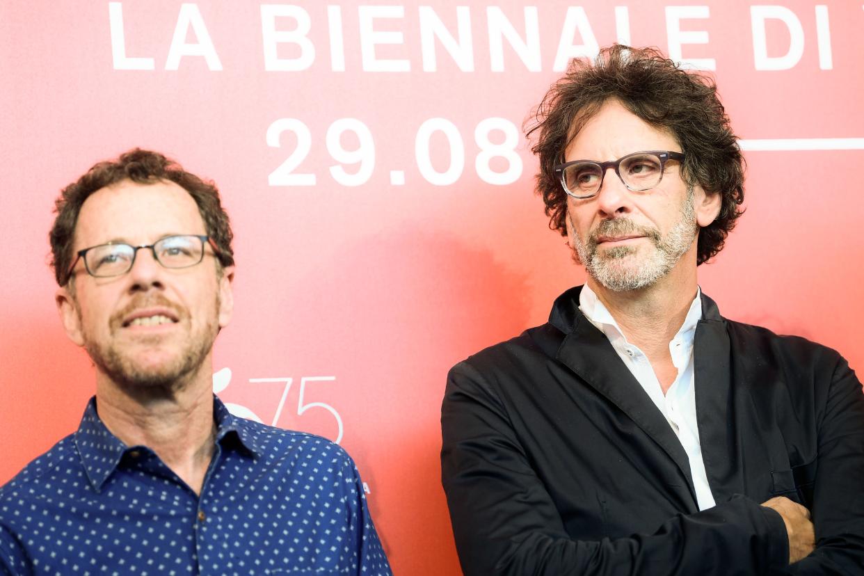 Director Ethan Coen (L) and his brother director Joel Coen attend a photocall for the film "The Ballad of Buster Scruggs" presented in competition on August 31, 2018 during the 75th Venice Film Festival at Venice Lido. (Photo by Filippo MONTEFORTE / AFP)        (Photo credit should read FILIPPO MONTEFORTE/AFP via Getty Images)