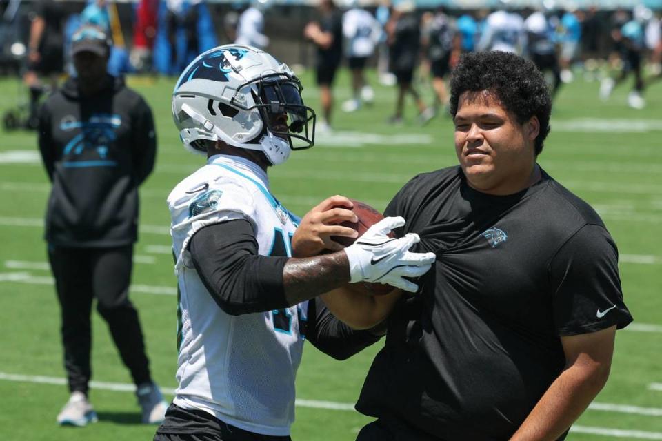 Panthers outside linebacker K’Lavon Chaisson (45) tries to knock a ball loose during minicamp practice in Charlotte, NC on Tuesday, June 11, 2024.