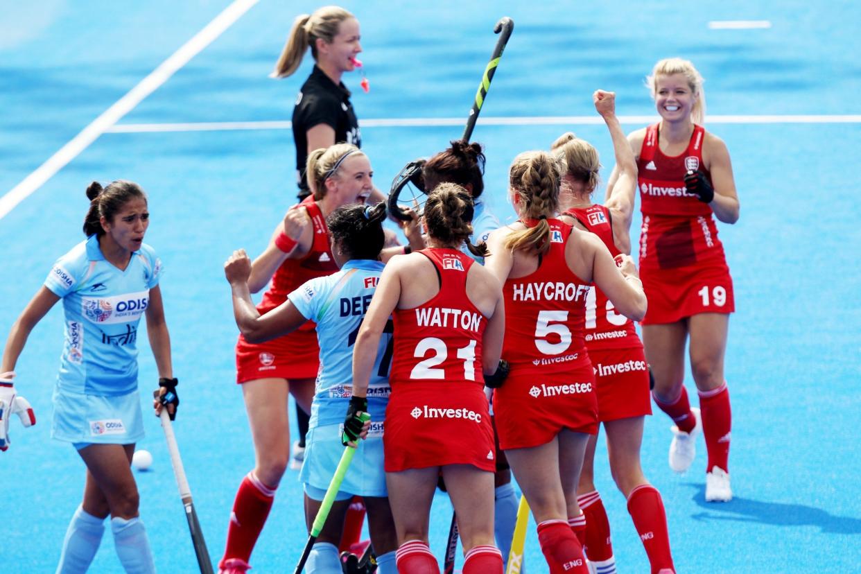 Late show: Lily Owsley celebrates with team-mates after her equaliser: EPA