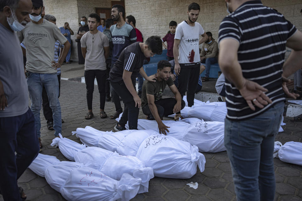 Palestinians mourn their relatives killed in the Israeli bombardment of the Gaza Strip, in front of the morgue in Deir al Balah, Wednesday, Nov. 1, 2023. ( AP Photo/Fatima Shbair)