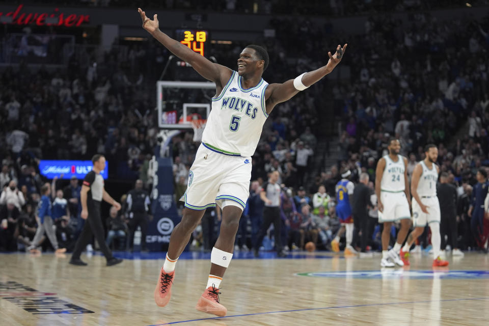 Minnesota Timberwolves guard Anthony Edwards (5) celebrates after scoring during the second half of an NBA basketball game against the Denver Nuggets, Tuesday, March 19, 2024, in Minneapolis. (AP Photo/Abbie Parr)