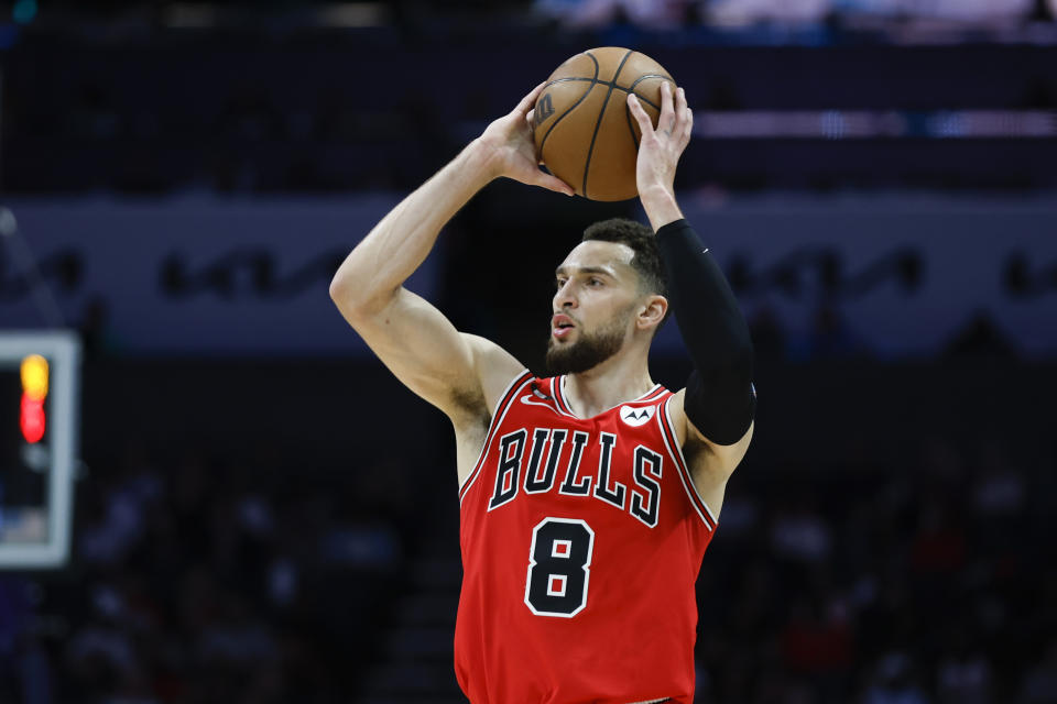 Chicago Bulls guard Zach LaVine looks to pass the ball during the first half of the team's NBA basketball game against the Charlotte Hornets in Charlotte, N.C., Friday, March 31, 2023. (AP Photo/Nell Redmond)