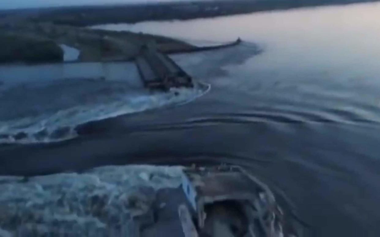 Water running through a breakthrough in the Kakhovka dam - Official channel of the President of Ukraine Volodymyr Zelenskyy