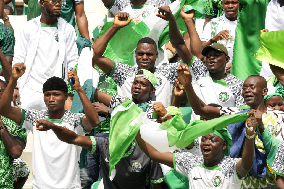 Nigeria's fans cheer during the African Cup of Nations Group A soccer match between Nigeria and Equatorial Guinea in Abidjan, Ivory Coast, Sunday, Jan. 14, 2024. (AP Photo/Sunday Alamba)