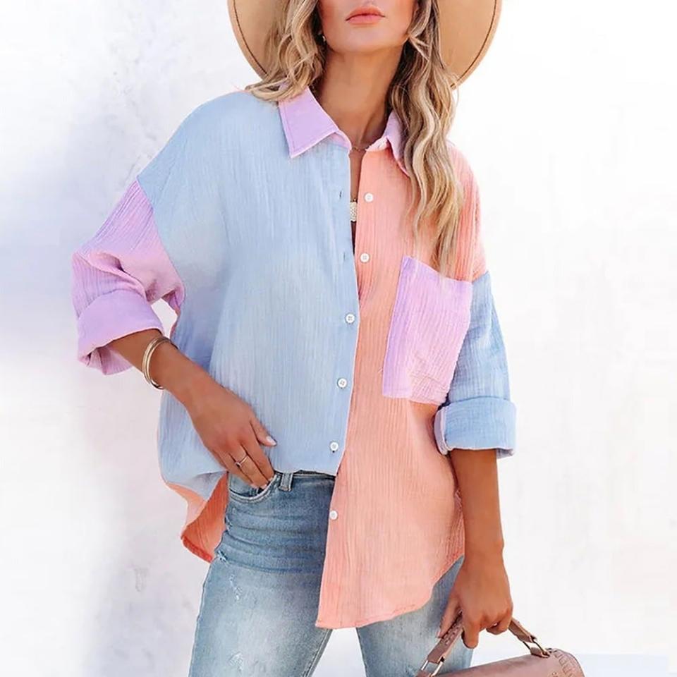 model wearing a pastel color-blocked, oversized shirt and jeans