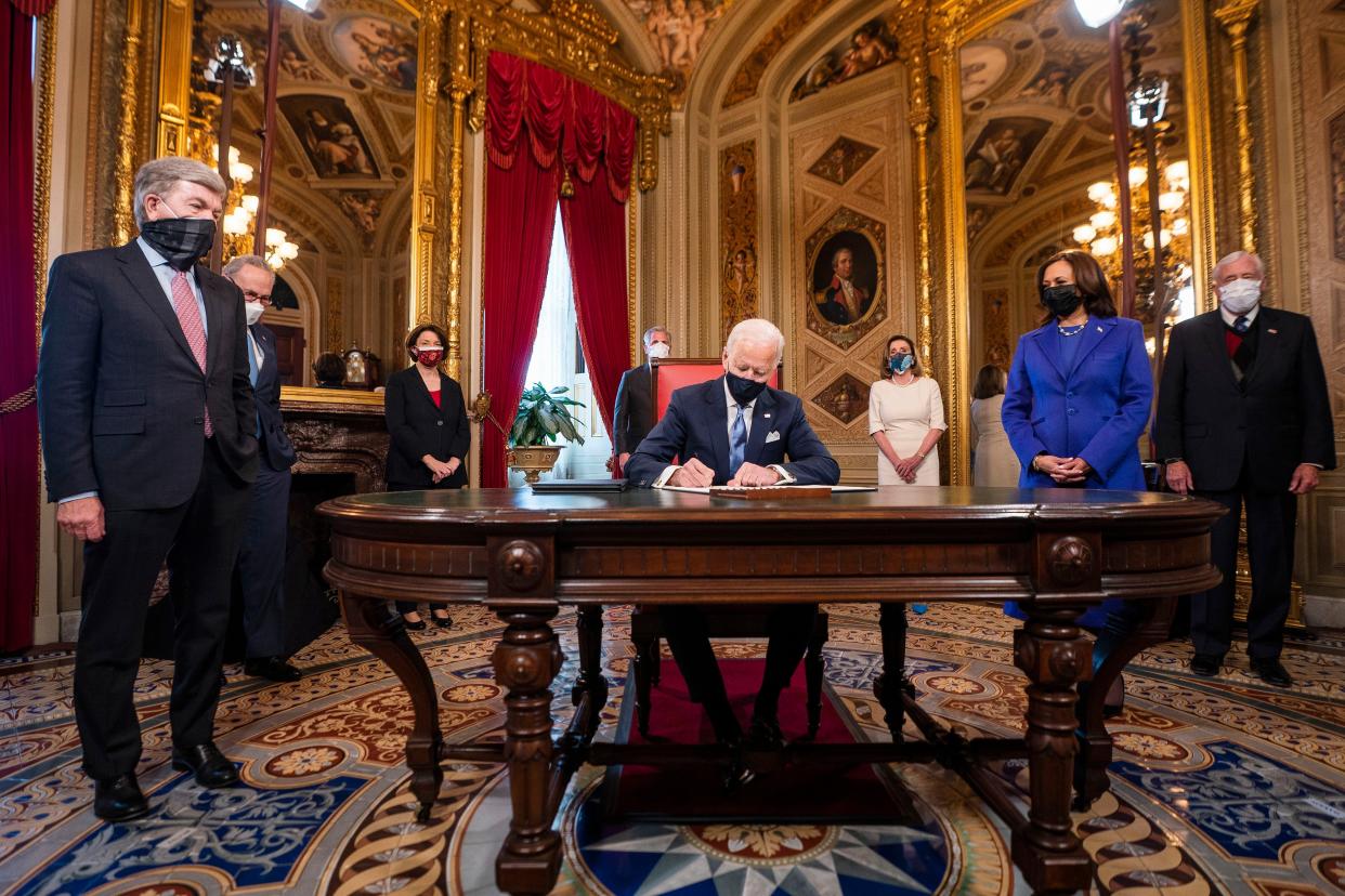 President Joe Biden signs three documents including an inauguration declaration, cabinet nominations and sub-cabinet nominations in the President's Room at the U.S. Capitol after the inauguration ceremony on Wednesday, Jan. 20, 2021.