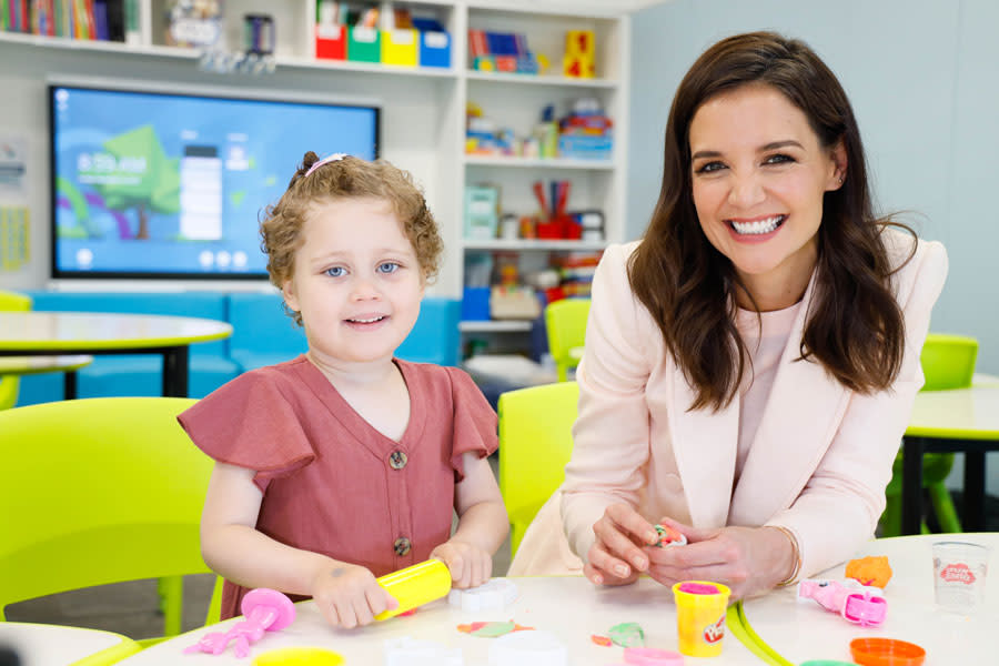 A photo of actor Katie Holmes playing with Play Doh with four-year-old patient Ellie Wild at Ronald McDonald House Westmead.