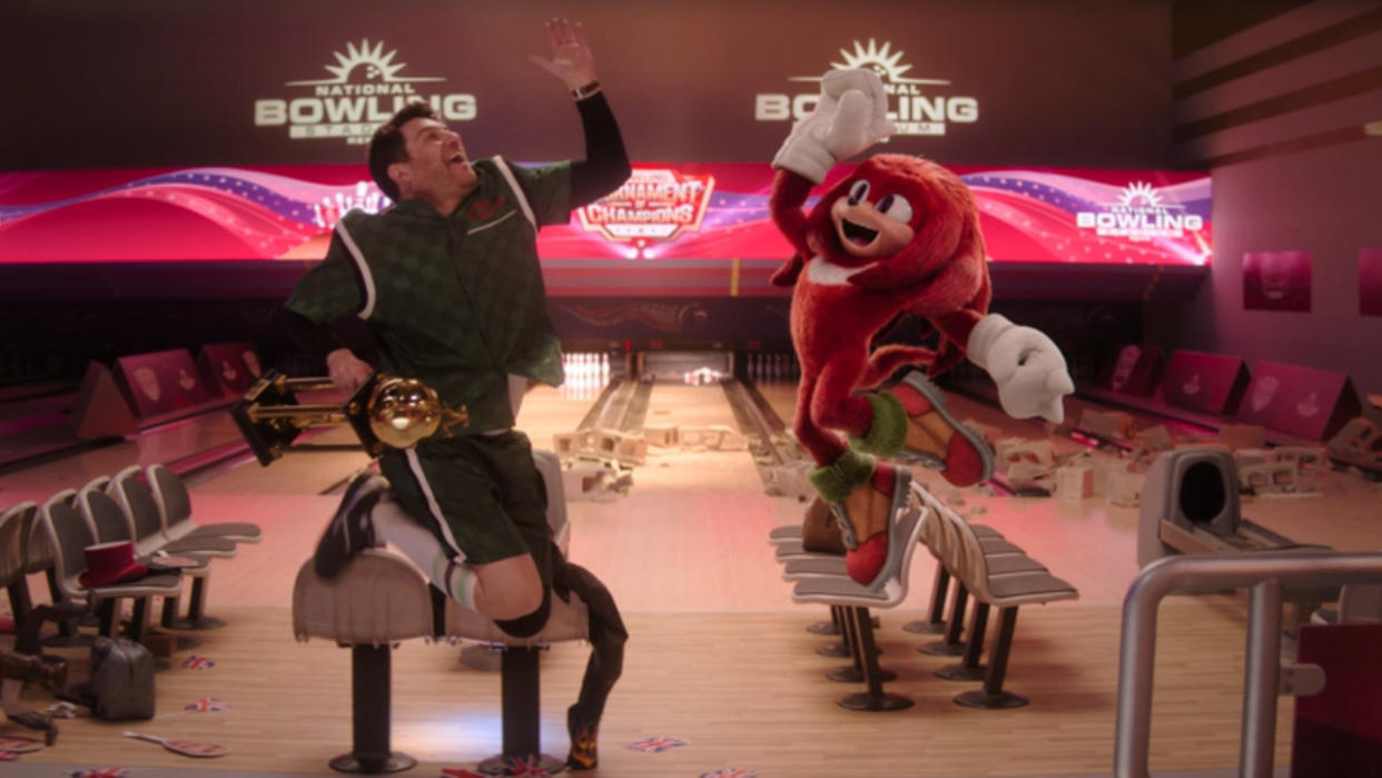  Wade Whipple (Adam Pally) jumping to give Knuckles a high five on Knuckles. 