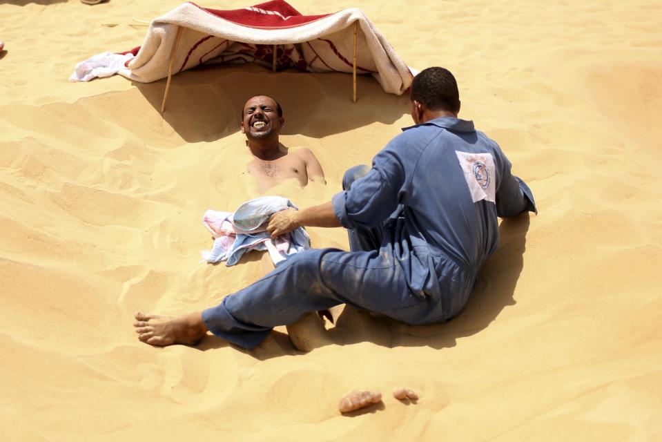 Wider Image: The Hot Sand Baths of Siwa