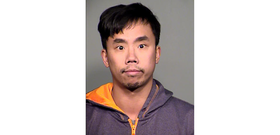 This undated booking photo provided by the Tempe Police Department shows Raymond Tang. Tang, described as a disgruntled former Waymo driver has been arrested on suspicion of deliberately crashing a passenger car into one of the company's vans with self-driving capabilities near Phoenix last month, authorities said Thursday, Feb. 13, 2020.(Tempe Police Department via AP)