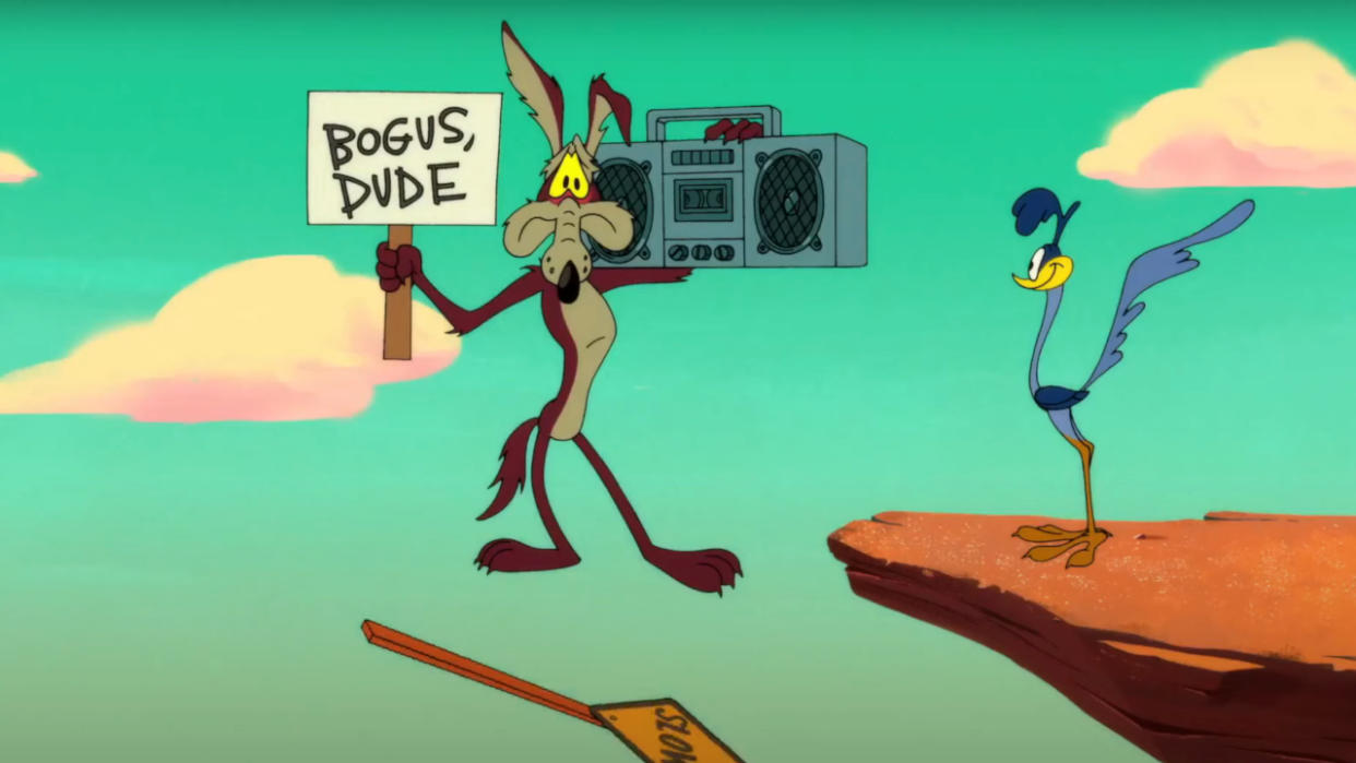  Wile E. Coyote about to plummet, while holding a sign and a boombox,  . 