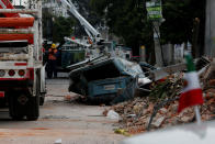 <p>A damaged wall and a smashed vehicle are pictured after an earthquake in Mexico City, Mexico Sept. 8, 2017. (Photo: Carlos Jasso/Reuters) </p>