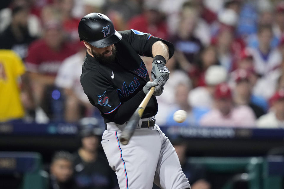 Miami Marlins' Jon Berti hits a double against Philadelphia Phillies pitcher Aaron Nola during the third inning of Game 2 in an NL wild-card baseball playoff series, Wednesday, Oct. 4, 2023, in Philadelphia. (AP Photo/Matt Slocum)