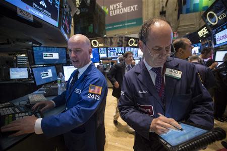 Traders work on the floor of the New York Stock Exchange April 3, 2014. REUTERS/Brendan McDermid