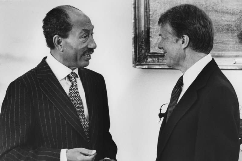 Egyptian President Anwar Sadat and U.S. President Jimmy Carter confer in the Oval Office of the White House in Washington prior to the peace treaty signing on March 26, 1979. On March 6, 1982, an Egyptian court sentenced five Muslim fundamentalists to death for the assassination of Sadat. UPI File Photo