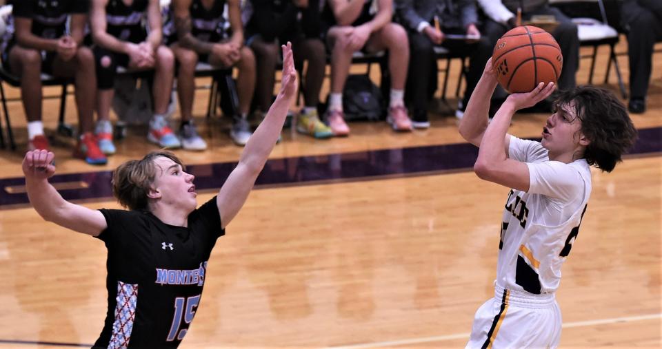 Wylie's Isaiah Carrillo, right, shoots as Lubbock Monterey's Carter Bovkoon defends in the first half.