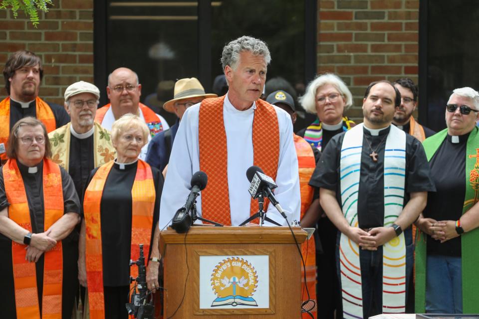 Rector Chris Yaw, of St. David’s Episcopal Church, along with other faith leaders and gun activists hold a press conference to announce their plans to destroy and transform unwanted firearms, during the Blessing of the Chop Saws event at in Southfield on June 18, 2024. People will be able to receive gift cards for the guns they trade in and the opportunity to transform the guns into artwork.