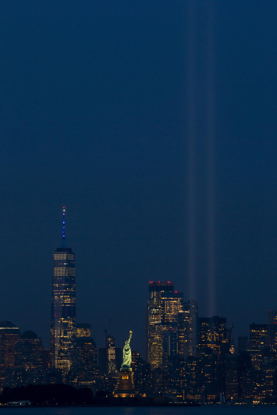 The Tribute in Light rises above the lower Manhattan skyline, Wednesday, Sept. 11, 2019 as seen from Bayonne, N.J. (AP Photo/Eduardo Munoz Alvarez)
