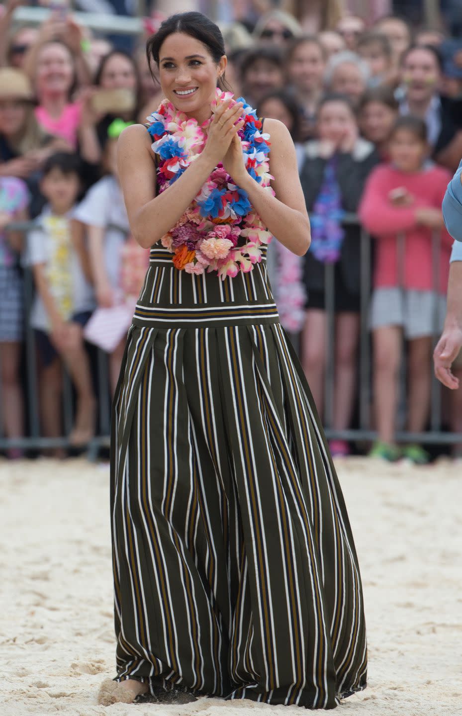 <p><strong>October 2018 </strong>The Duchess of Sussex wore a striped Martin Grant dress and Karen Walker earrings at Bondi Beach.</p>