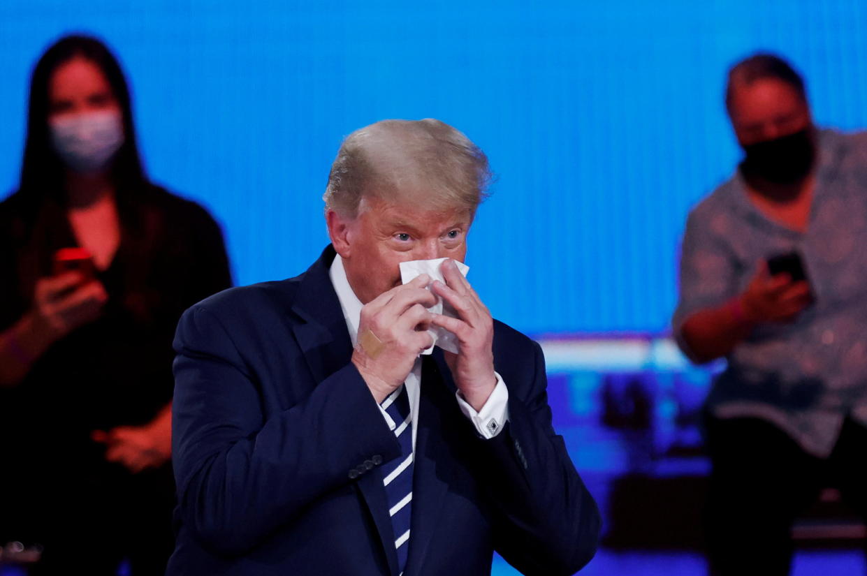 President Trump wipes his nose part during an NBC News town hall in Miami Thursday. (Carlos Barria/Reuters)