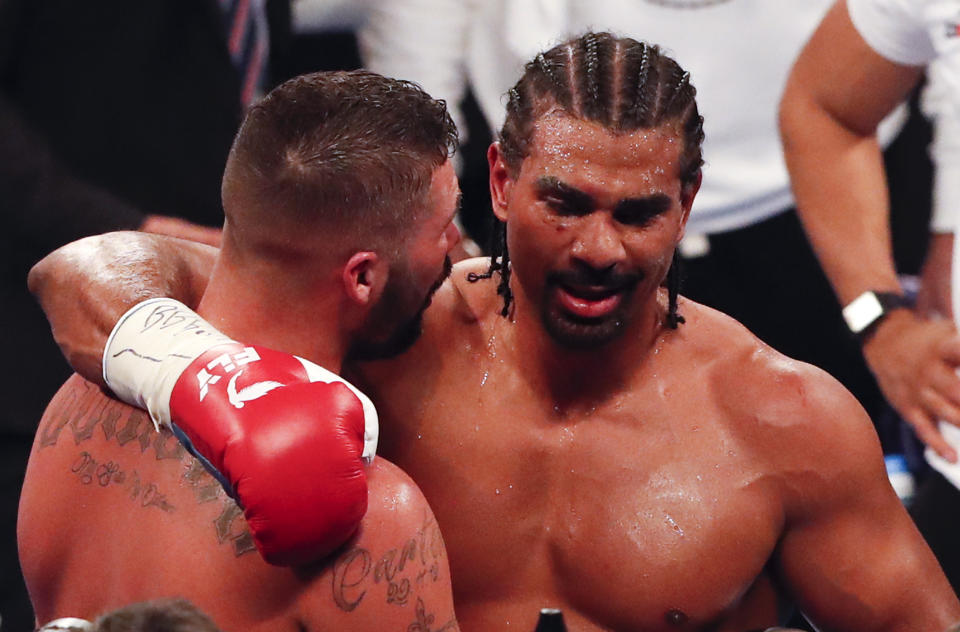 Glory moment: Tony Bellew, left, stands in the ring with David Haye as he celebrates his victory over his countryman