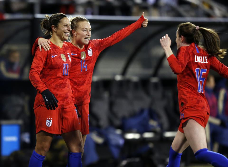 United States forward Carli Lloyd, left, defender Emily Sonnett, center, and midfielder Rose Lavelle celebrate Lloyd's second goal against Sweden during the first half of a women's international friendly soccer match in Columbus, Ohio, Thursday, Nov. 7, 2019. (AP Photo/Paul Vernon)