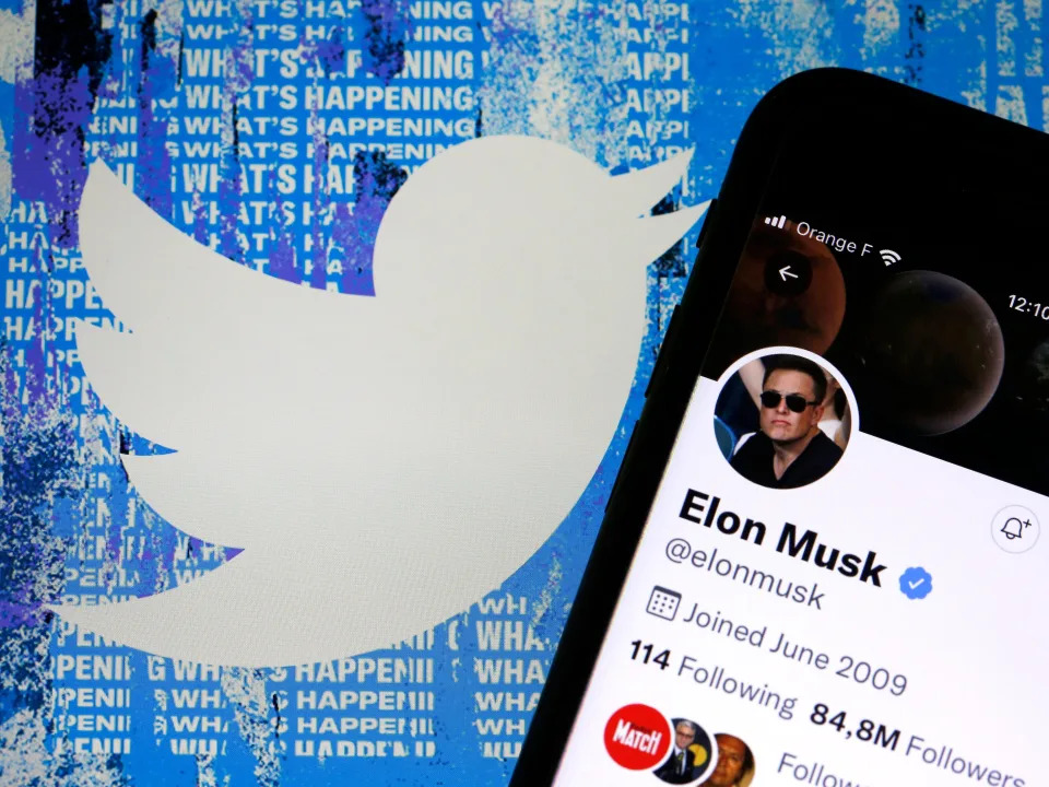 Elon Musk Twitter on phone and the Twitter logo