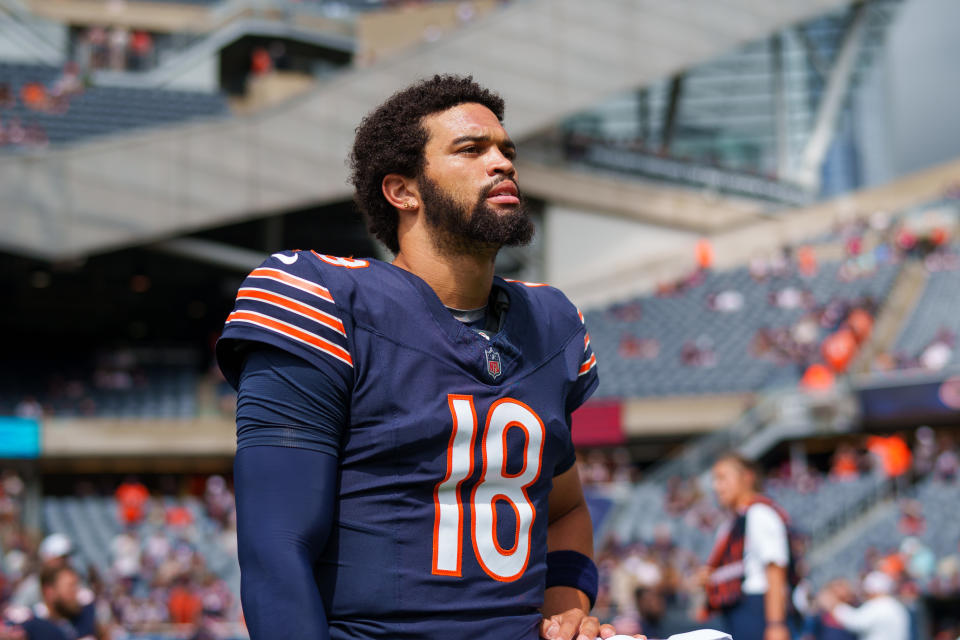 CHICAGO, IL - AUGUST 17: Caleb Williams #18 of the Chicago Bears stretches prior to an an NFL preseason football game against the Cincinnati Bengals, at Soldier Field on August 17, 2024 in Chicago, Illinois. (Photo by Todd Rosenberg/Getty Images)