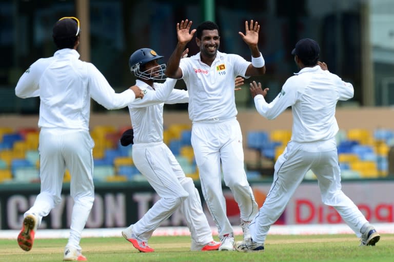 Sri Lanka's Dhammika Prasad (2nd R) celebrates with teammates after he dismissed India's Lokesh Rahul on the opening day of the third and final Test in Colombo on August 28, 2015