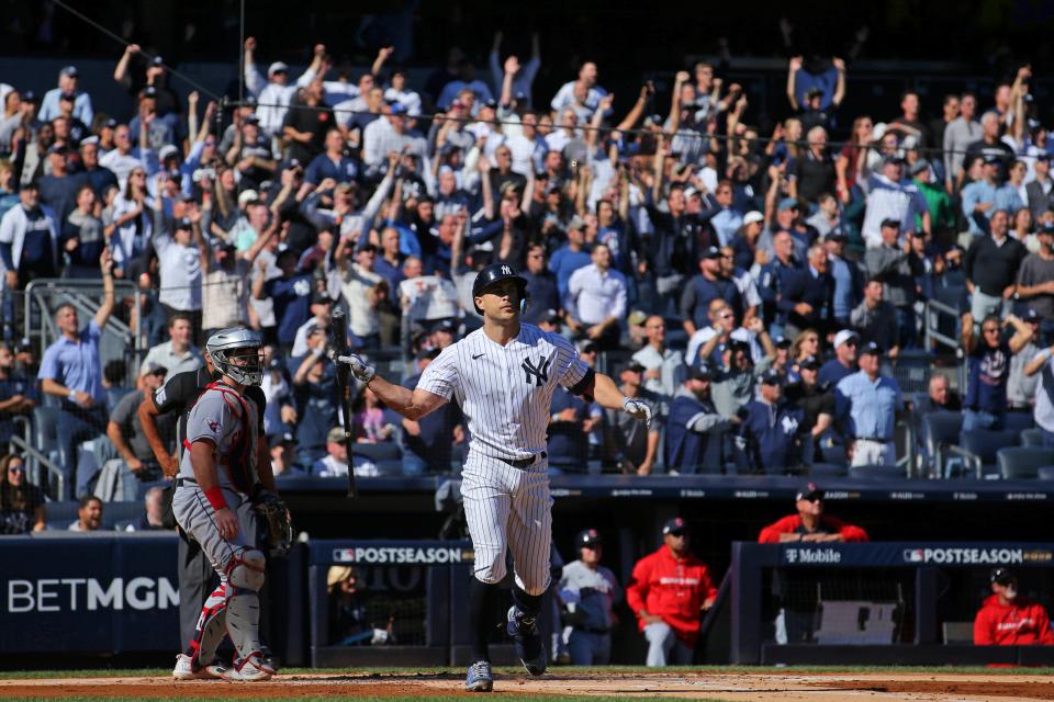Oct 14, 2022; Bronx, New York, USA; New York Yankees designated hitter Giancarlo Stanton (27) reacts after hitting a two-run home run against the Cleveland Guardians during the first inning in game two of the ALDS for the 2022 MLB Playoffs at Yankee Stadium. Mandatory Credit: Brad Penner-USA TODAY Sports