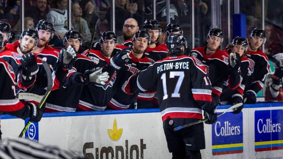 Forward Ty Pelton-Byce skates through a line of fist bumps from teammates after putting the Steelheads up 4-0 in the second period against the Kansas City Mavericks on Wednesday at Idaho Central Arena in downtown Boise.