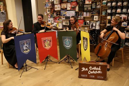 A string quartet plays music at an event to mark the release of the book of the play of Harry Potter and the Cursed Child parts One and Two at a bookstore in London, Britain July 30, 2016. REUTERS/Neil Hall