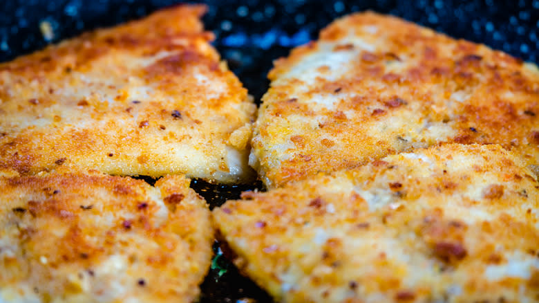 tilapia frying in pan