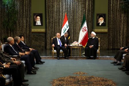 Iranian President Hassan Rouhani meets with Iraqi Prime Minister Haider Al-Abadi, in Tehran, Iran, October 26, 2017. President.ir/Handout via REUTERS ATTENTION EDITORS - THIS PICTURE WAS PROVIDED BY A THIRD PARTY. NO RESALES. NO ARCHIVE.