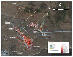 Plan view map illustrating the projected drill traces from the 2019/2020 drill programs on the Scottie Gold Mine, superimposed over significant M-Zone and O-Zone historic drill results (red shaded disc). Light blue lines represent projected historic underground workings.