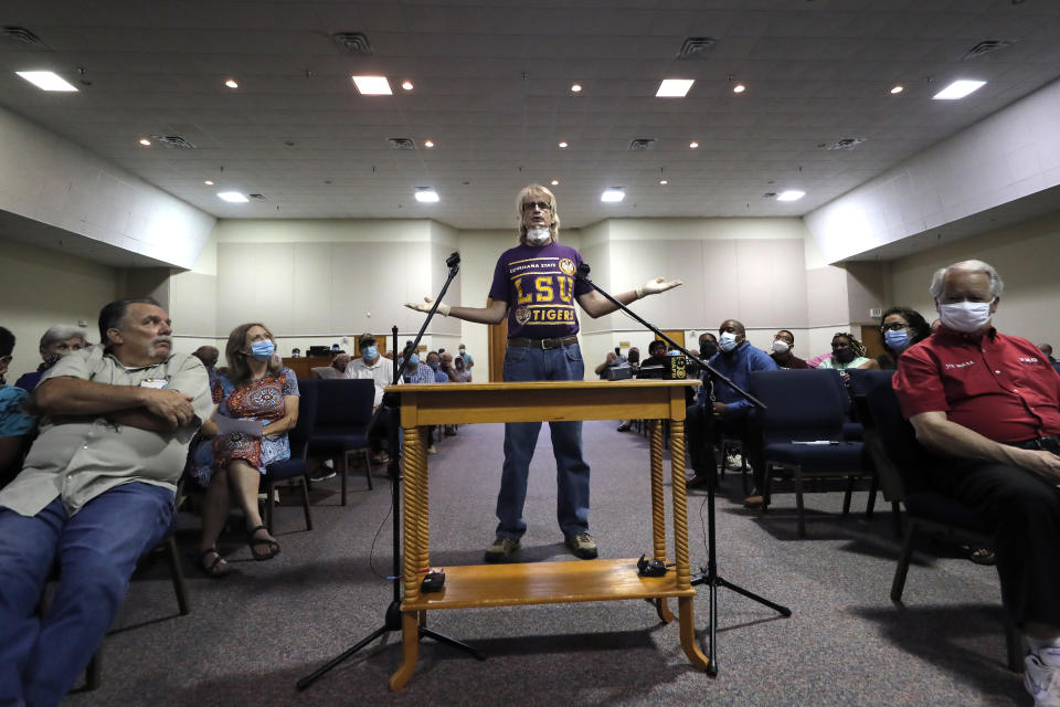 Timothy Strohschein, of McManus, La. speaks in favor of keeping a statue of a Confederate soldier in front of the East Feliciana Parish courthouse, at a town hall meeting in Clinton, La., on June 30, 2020. As protests sparked by the death of George Floyd in Minneapolis focus attention on the hundreds of Confederate statues still standing across the Southern landscape, officials in the rural parish of roughly 20,000 people recently voted to leave the statue where it is. (AP Photo/Gerald Herbert)